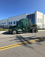 Green Kenworth on the road