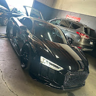 Audi R8 sports car in smog inspection bay